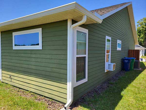 beautiful florida home with newly installed gutters by moonshine gutter and drain.